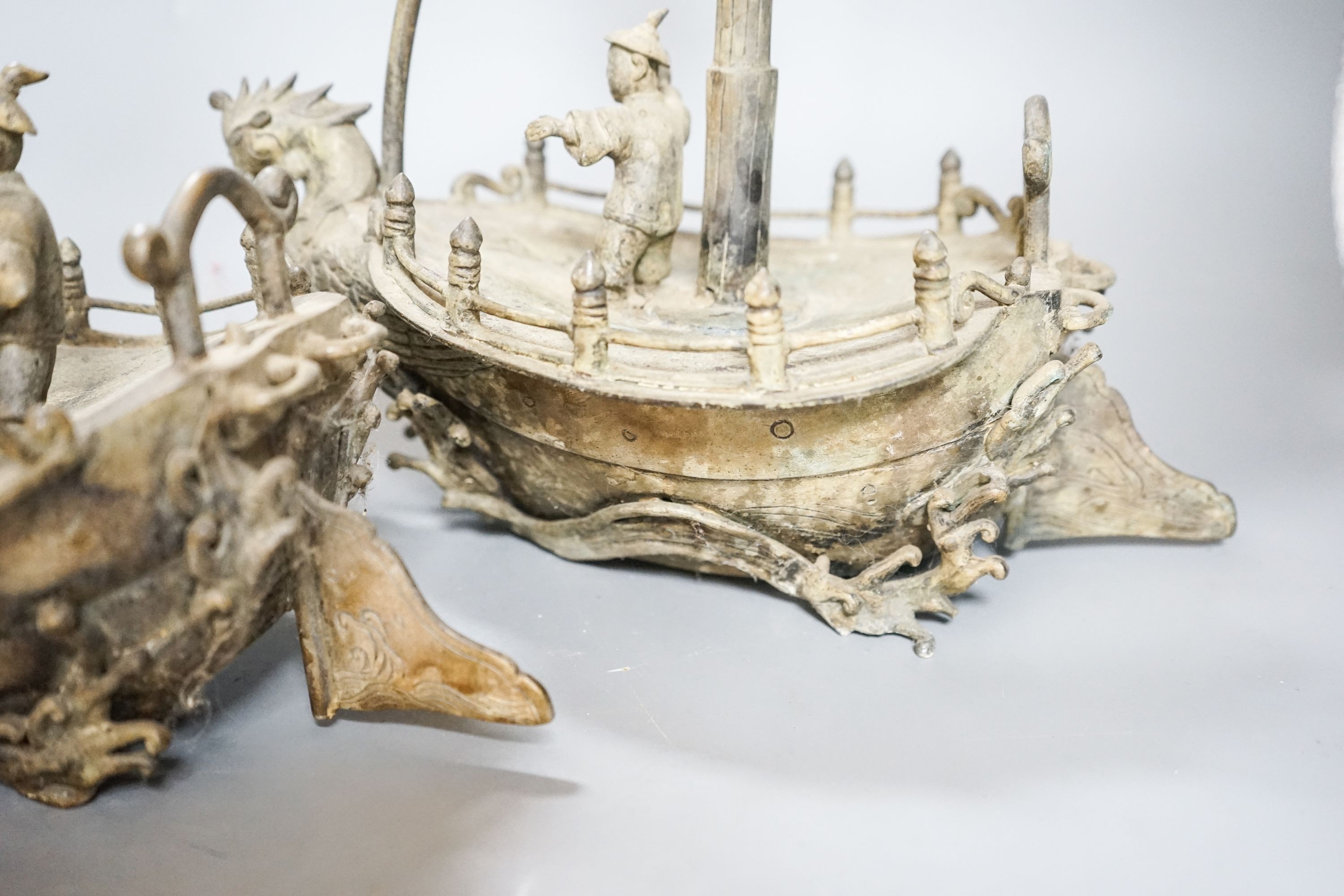 A pair of Chinese brass ‘ship’ lamp stands, 41cm